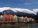 row of houses in mariahilf with snowy mountain background